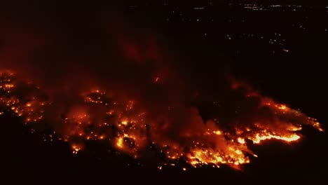 nighttime drone footage of a forest fire in canada