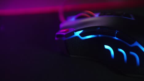 close up shot of a hand clicking the mouse button while playing games and clicking on a computer