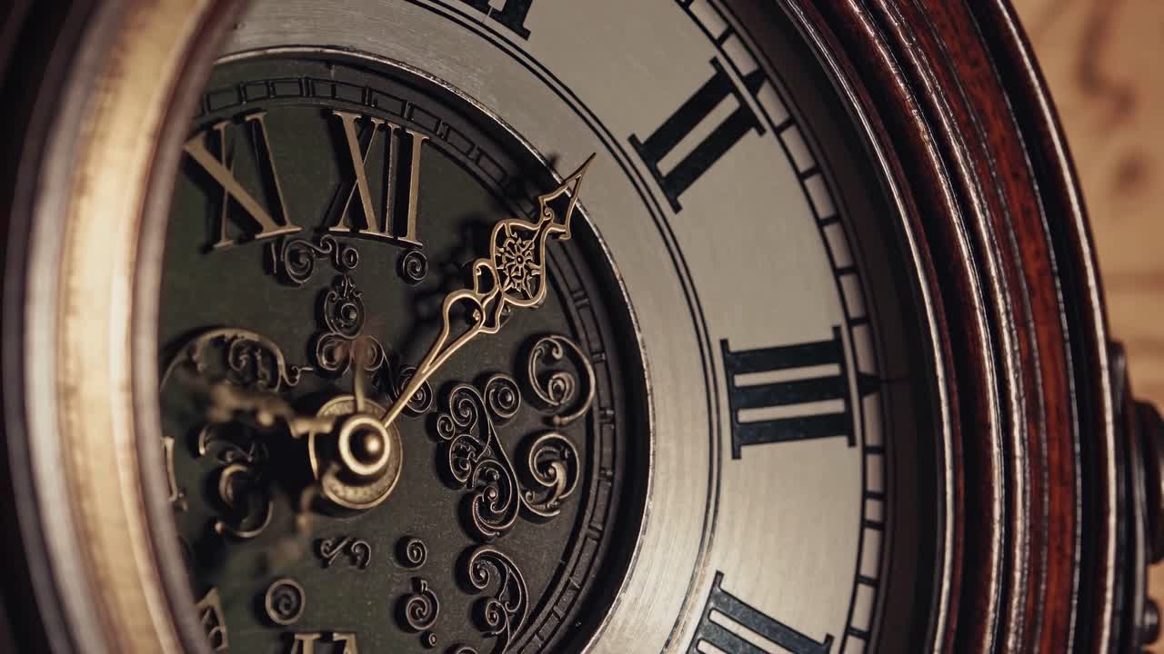 Close-up video of a vintage clock face, showcasing ornate hands and Roman numerals