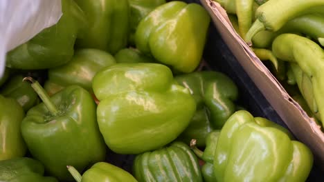 close-up of green bell peppers in a basket