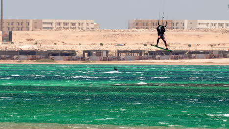 talented windsurfer jumps high on hurghada beach, egypt windsurfing water sport in touristic red sea destination, 60 fps