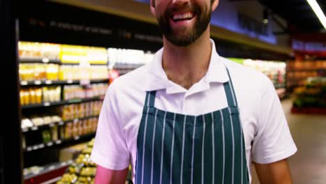 Male-staff-holding-fresh-capsicum-in-wicker-basket