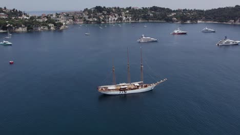 Luxury-Yachts-and-Boats-in-Mediterranean-Sea-Bay-in-Cannes,-France---Aerial