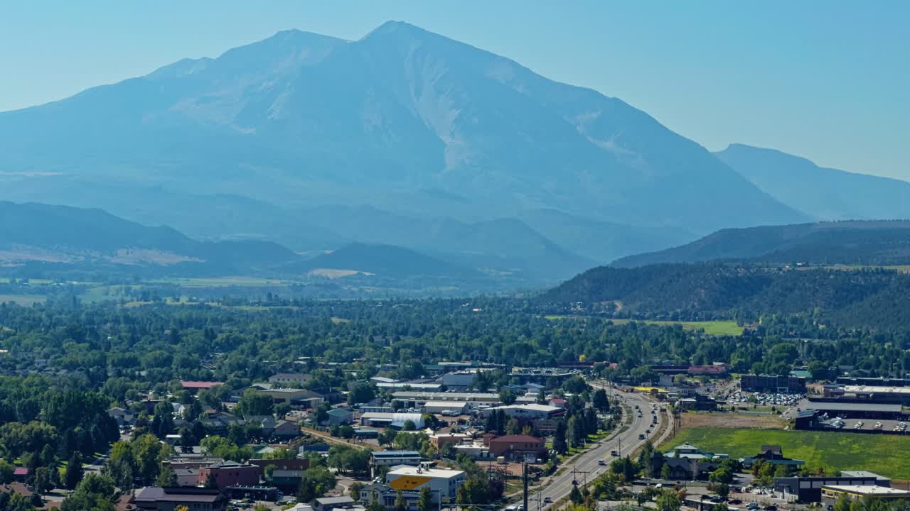 Tall peak rising above landscape with soft clouds, dramatic mountain backdrop in full view, Red Hill Carbondale Colorado