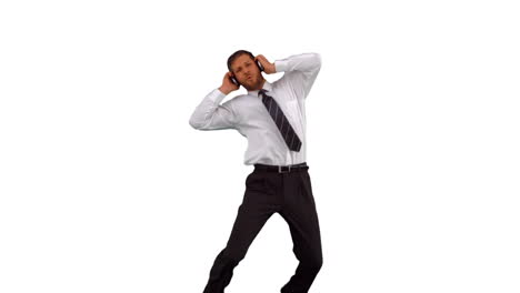 Businessman-jumping-up-and-listening-to-music