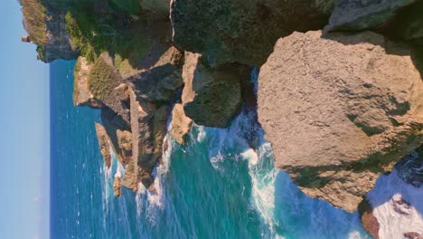 waves breaking on rocky cliff of french cape or cabo frances in dominican republic