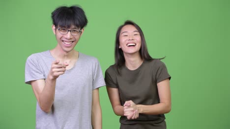 young asian couple laughing together