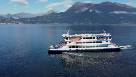 Aerial-view-of-a-ferry-navigating-Lake-Como,-Italy