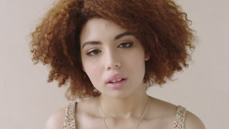 portrait-of-young-mixed-race-girl-looking-at-camera-pensive-close-up-of-beautiful-female-afro-hair-bored-waiting