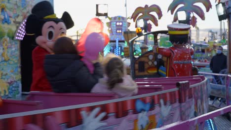 people enjoying rides at a funfair
