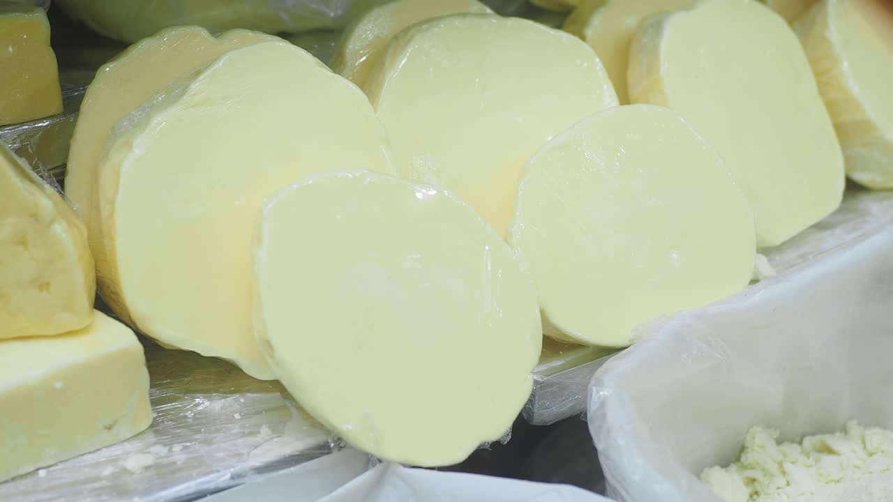 Assortment of Fresh Dairy Cheese Products on Display