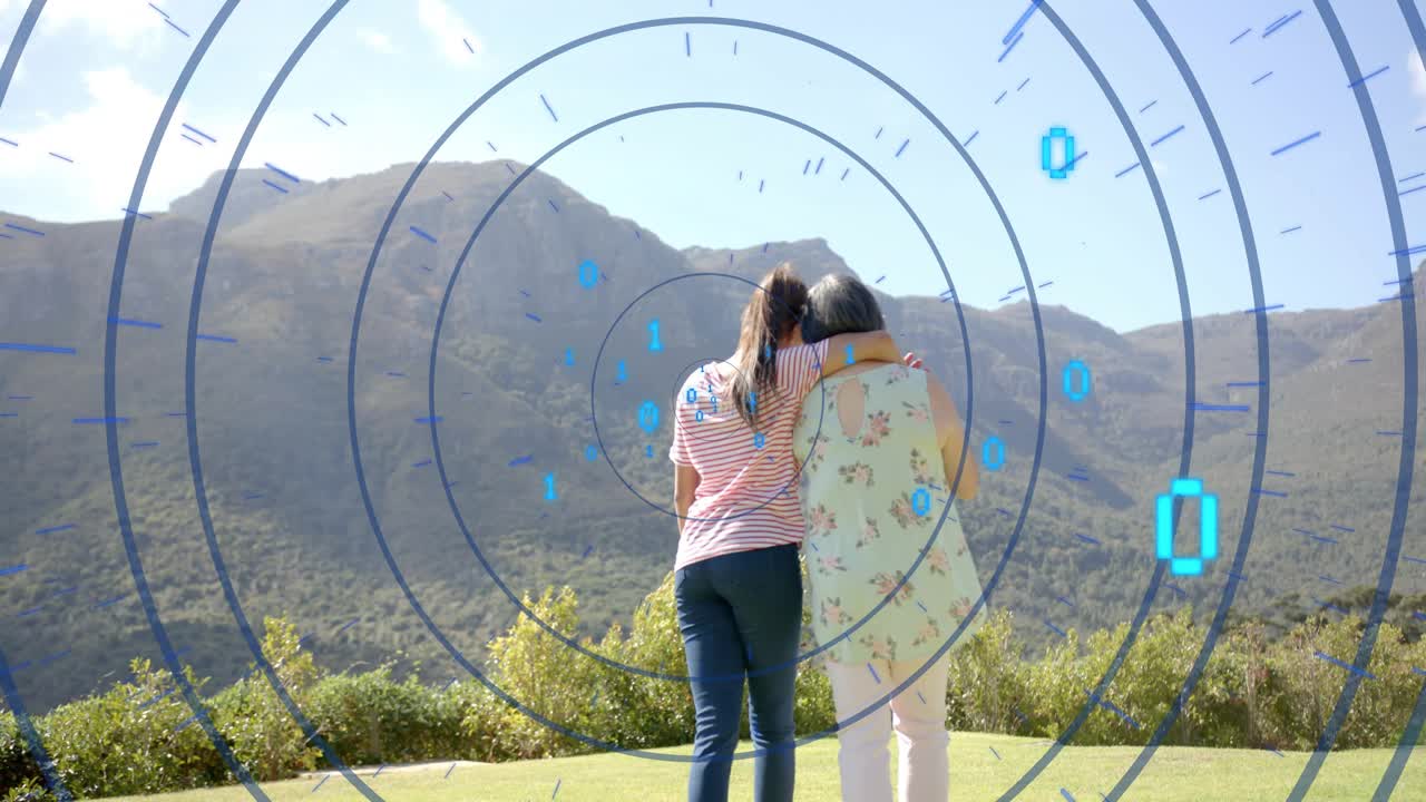 Teen reaching, draping arm over mature woman, walking to ridge, binary overlaying tech showing care