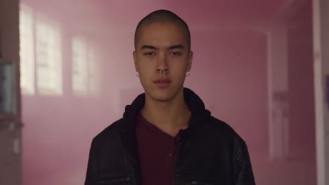 fashionable young man in an abandoned warehouse