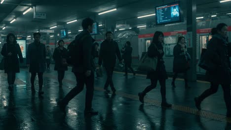 a mysterious evening in an urban train station: passengers navigate the dimly lit platform in a rain-soaked scene, capturing the mood of daily commutes