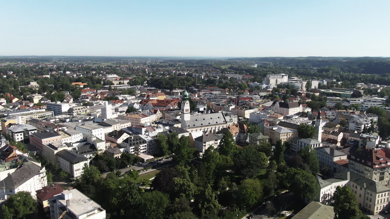 Aerial shot of the city of Rosenheim flying towards theNeo-gothic St. Nikolaus Church flying showing more detailof the old beautiful building.