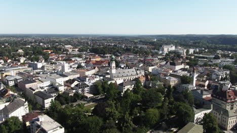 aerial shot of the city of rosenheim flying towards theneo-gothic st. nikolaus church flying showing more detailof the old beautiful building.