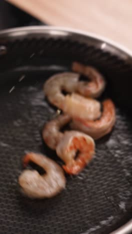 cooking shrimp in a pan