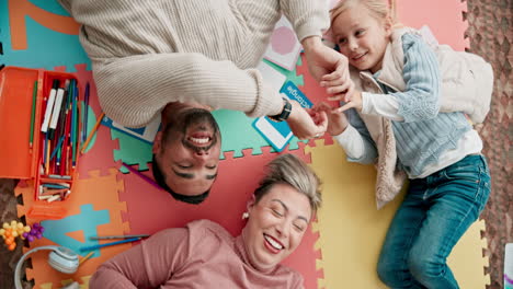 top view, play and parents with child on floor