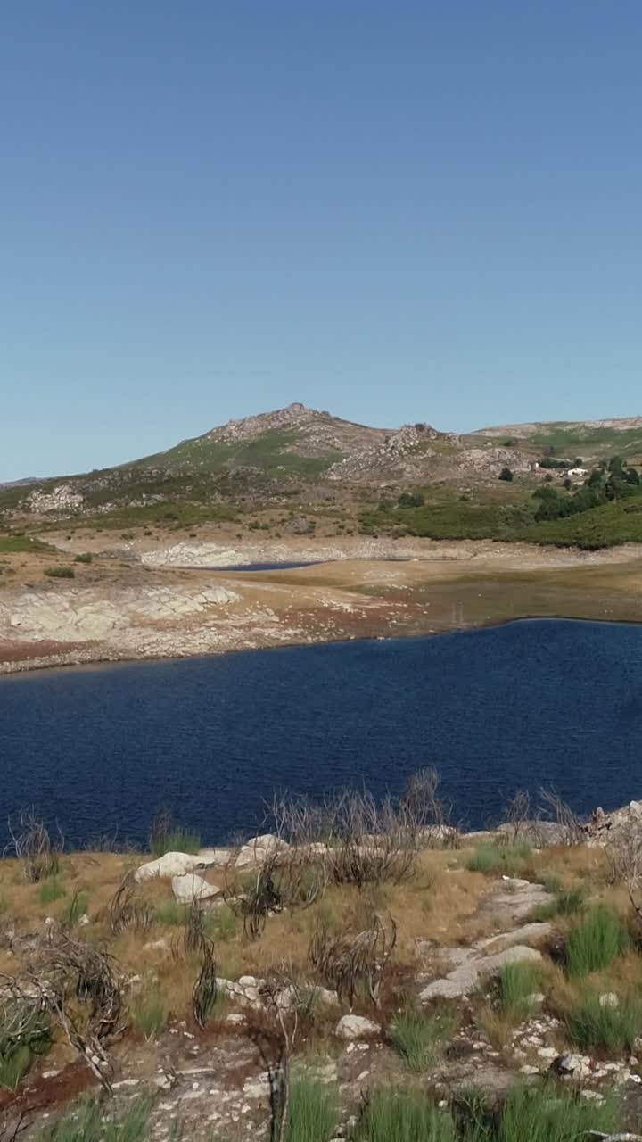 Beautiful Nature Landscape. Blue Lake and Green Mountains Vertical Video