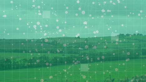 green landscape with grid and floating white circles animation overlay