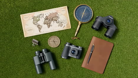 travel and exploration gear on green grass