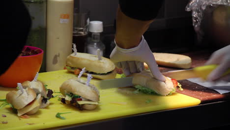 Caterer-cutting-sandwiches