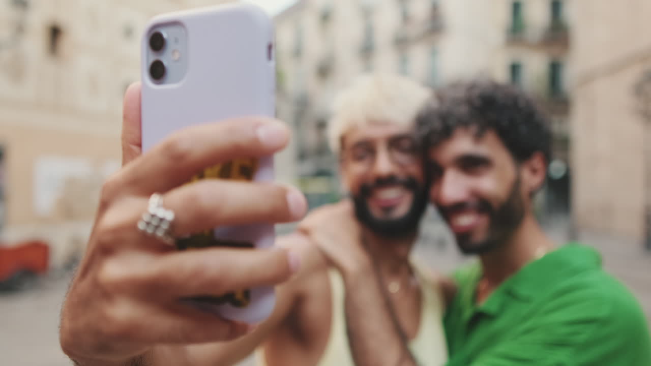 Happy Couple Taking a Selfie on an Urban Street