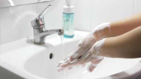 concept of health cleaning and preventing from coronavirus or covid-19 pandemic prevention wash hands with soap and warm water rubbing fingers washing frequently or using hand sanitizer gel