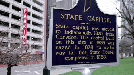 Indiana-State-Capitol-historical-marker-on-the-grounds-of-the-capitol-building-in-Indianapolis,-Indiana-with-video-panning-left-to-right