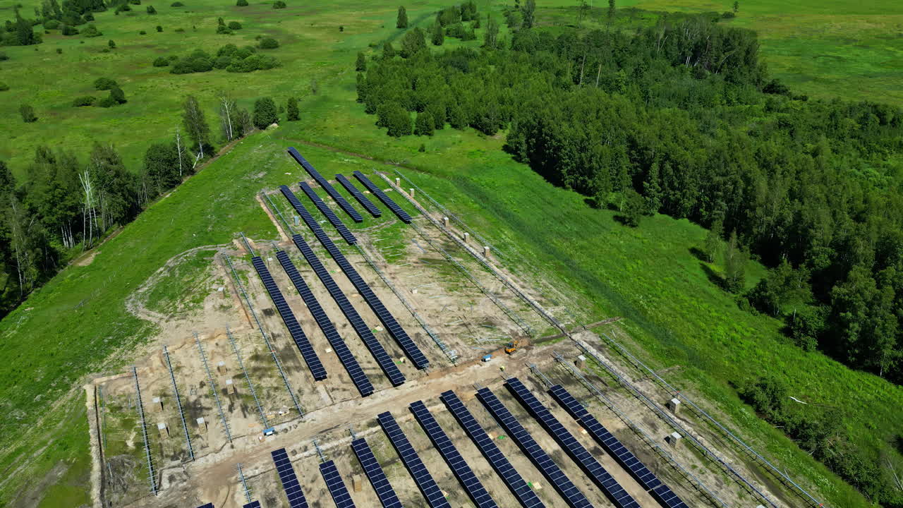 Field of solar panels seen from above, going further away