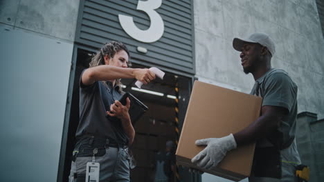 logistics team processing and handling packages at a warehouse