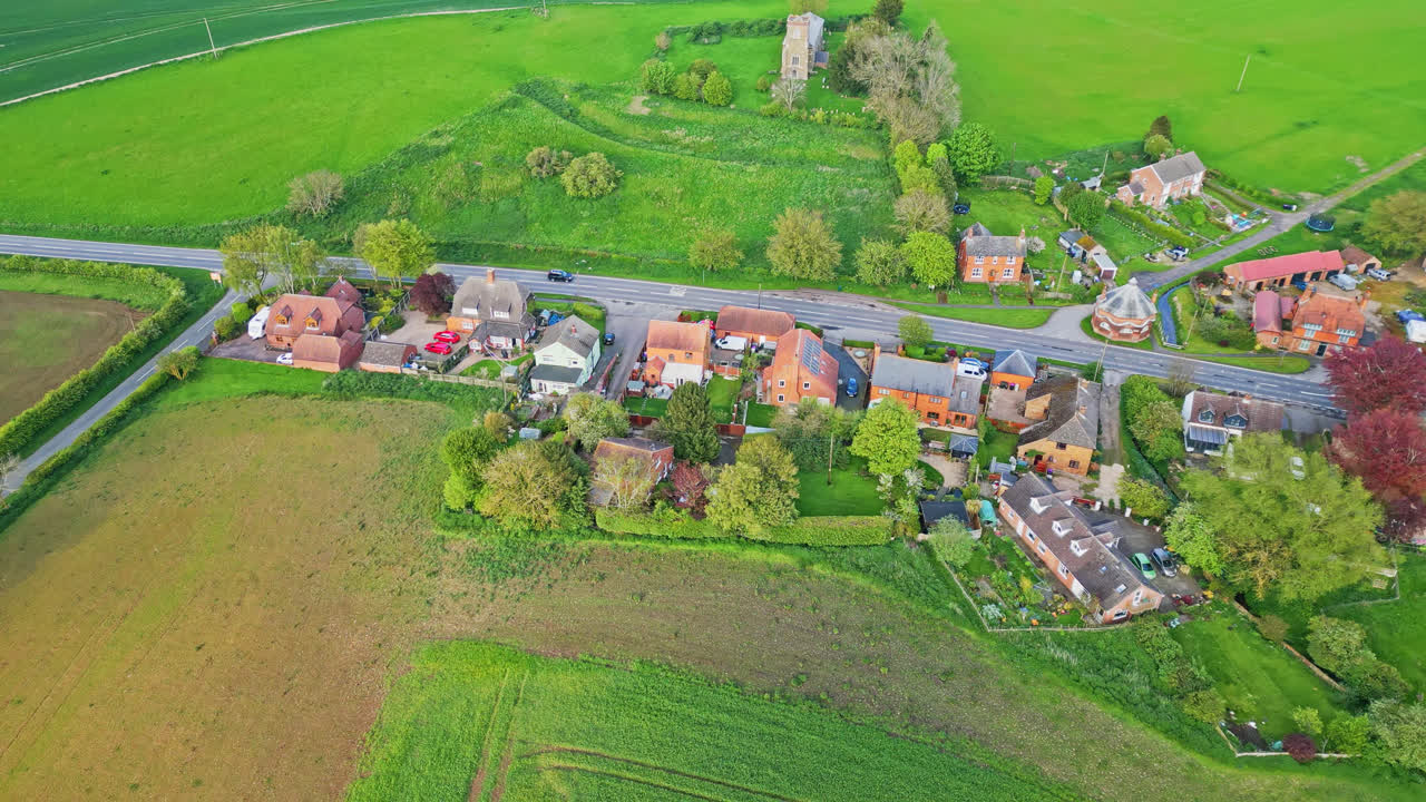 Burwell village's evolution from medieval market town shown in drone footage&mdash;countryside fields, historic red brick homes, and the disused Saint Michael parish church on Lincolnshire's Wold Hills