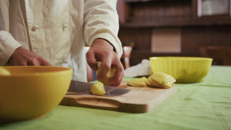 chef chopping potatoes