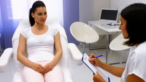 doctor and female patient interacting with each other