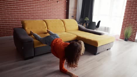 little girl playing at home with mother and climbing on her piggyback