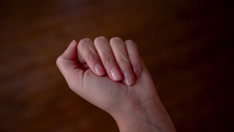 female hand with aspirin pills