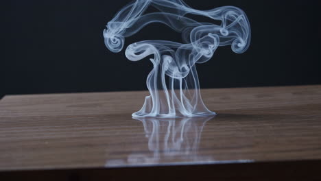 smoke experiment on a wooden table