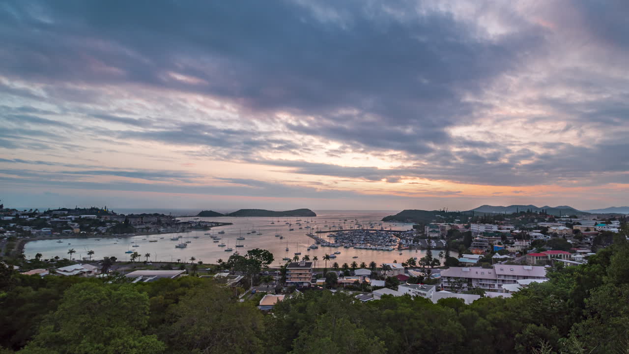 Sunset to nighttime time lapse of Orphanage Bay or Baie de l'Orphelinat in Noumea, New Caledonia
