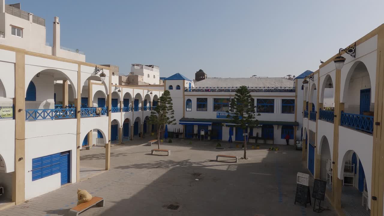 View of traditional blue and white architecture and place El Khaima, Essaouira