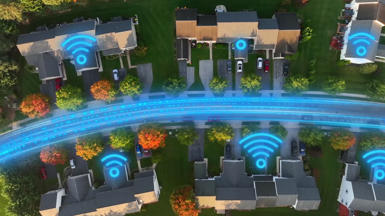 Top-down drone shot of a suburban neighborhood enhanced with glowing Wi-Fi symbols and a digital data stream along the roadway, modern home connectivity and broadband networks