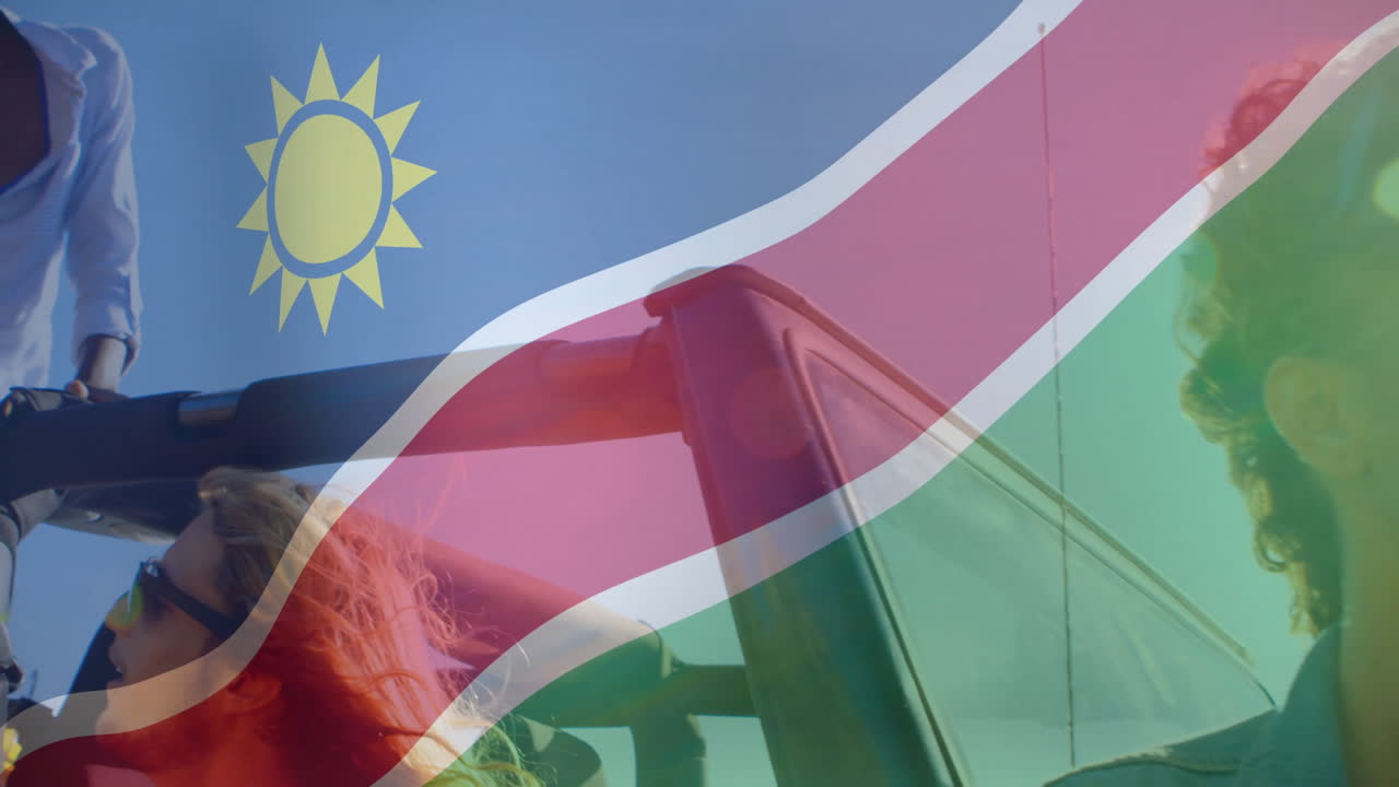 Animation of Namibian flag on people riding convertible car on sunny day