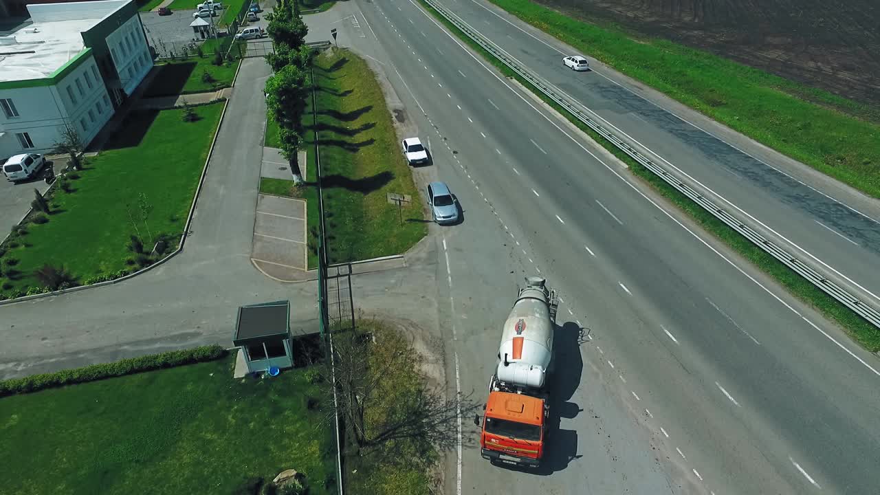 Construction With Concrete Mixer Truck. Aerial view of heavy concrete truck on construction site