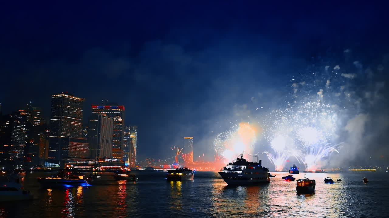 Spectacular firework show on the Independence Day celebration. Night celebration of 4th July in New York, USA. View from the river