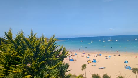 st ives in cornwall from train with harbour and beach with people sunbathing