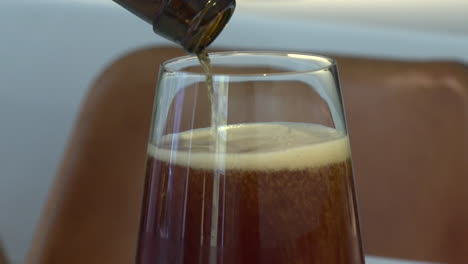 pouring beer into a wine glass