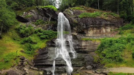 steinsdalsfossen is a waterfall in the village of steine in the municipality of kvam in hordaland county, norway. the waterfall is one of the most visited tourist sites in norway.