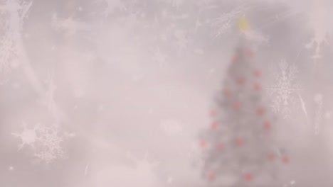 snowflakes falling over christmas tree on winter landscape