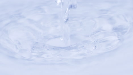 Water-splash-on-white-background.-Macro-slomo