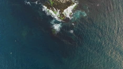 waves breaking into the rocks