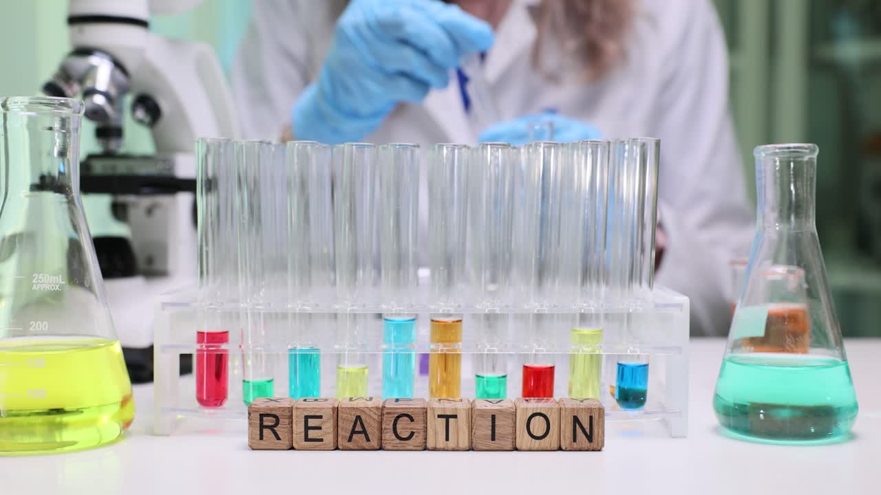 Chemistry Experiment in a Laboratory with Test Tubes and 'Reaction' Blocks